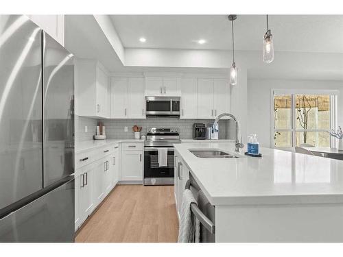 124-42 Cranbrook Gardens Se, Calgary, AB - Indoor Photo Showing Kitchen With Stainless Steel Kitchen With Double Sink With Upgraded Kitchen