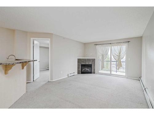 3406-60 Panatella Street Nw, Calgary, AB - Indoor Photo Showing Living Room With Fireplace