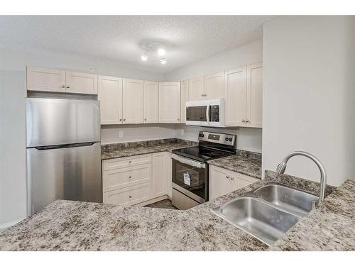 3406-60 Panatella Street Nw, Calgary, AB - Indoor Photo Showing Kitchen With Stainless Steel Kitchen With Double Sink