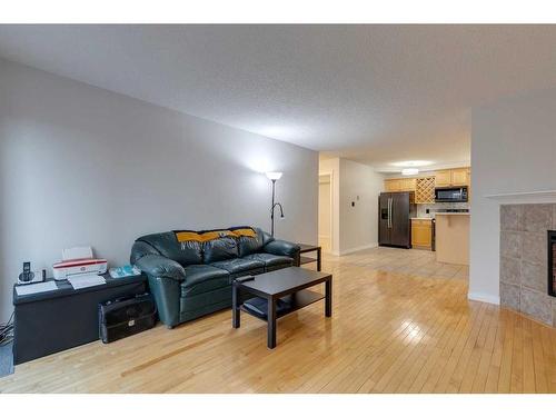 401-1331 15 Avenue Sw, Calgary, AB - Indoor Photo Showing Living Room With Fireplace