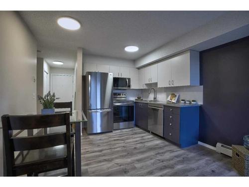 8103-304 Mackenzie Way Sw, Airdrie, AB - Indoor Photo Showing Kitchen With Stainless Steel Kitchen