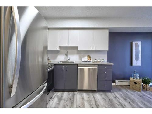 8103-304 Mackenzie Way Sw, Airdrie, AB - Indoor Photo Showing Kitchen With Stainless Steel Kitchen