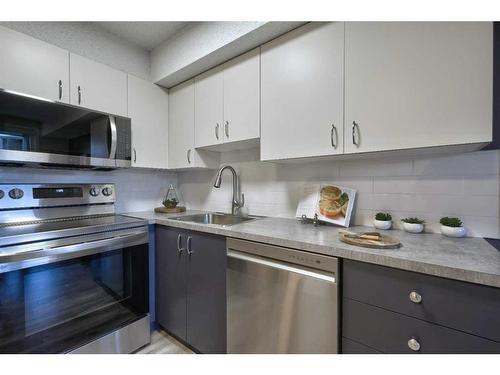 8103-304 Mackenzie Way Sw, Airdrie, AB - Indoor Photo Showing Kitchen With Stainless Steel Kitchen