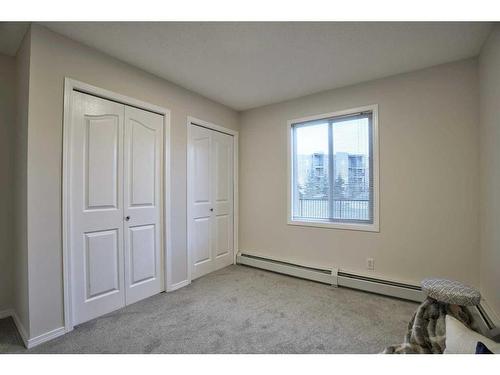 8103-304 Mackenzie Way Sw, Airdrie, AB - Indoor Photo Showing Other Room