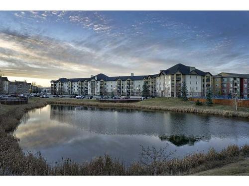 8103-304 Mackenzie Way Sw, Airdrie, AB - Outdoor With Body Of Water With View