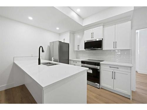 2210 33 Street Sw, Calgary, AB - Indoor Photo Showing Kitchen With Double Sink With Upgraded Kitchen