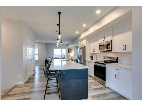 202 Harvest Grove Walk Ne, Calgary, AB - Indoor Photo Showing Kitchen With Upgraded Kitchen