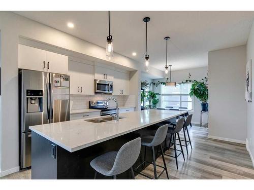 202 Harvest Grove Walk Ne, Calgary, AB - Indoor Photo Showing Kitchen With Stainless Steel Kitchen With Double Sink With Upgraded Kitchen