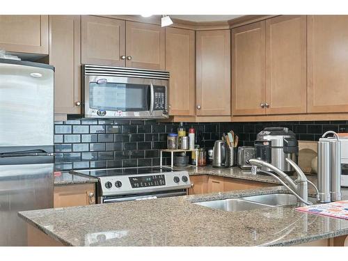 1607-910 5 Avenue Sw, Calgary, AB - Indoor Photo Showing Kitchen With Double Sink