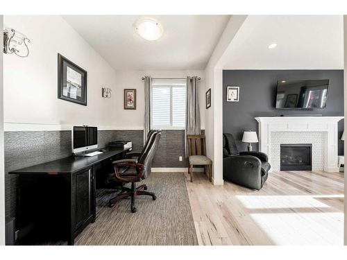 550 Bayview Way Sw, Airdrie, AB - Indoor Photo Showing Office With Fireplace