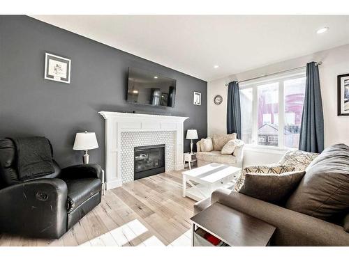 550 Bayview Way Sw, Airdrie, AB - Indoor Photo Showing Living Room With Fireplace