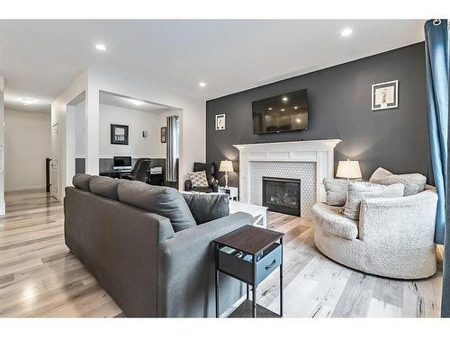 550 Bayview Way Sw, Airdrie, AB - Indoor Photo Showing Living Room With Fireplace