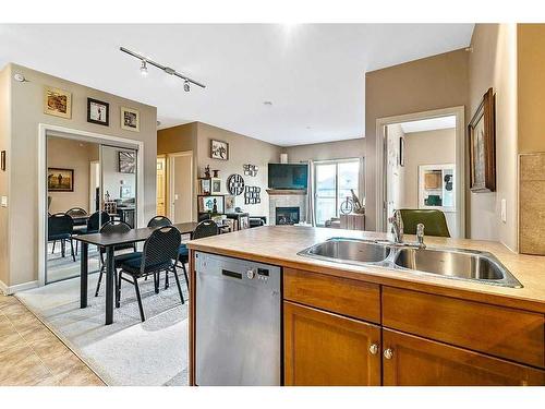 3401-92 Crystal Shores Road, Okotoks, AB - Indoor Photo Showing Kitchen With Double Sink