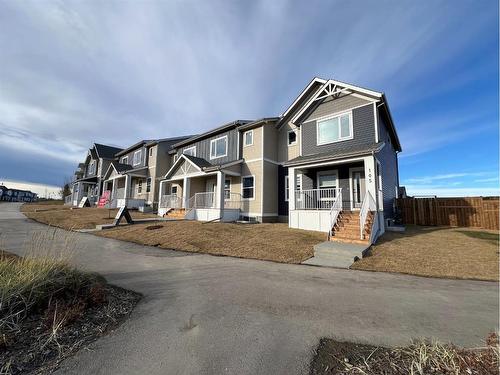 101 Riversong Boulevard, Cochrane, AB - Outdoor With Facade