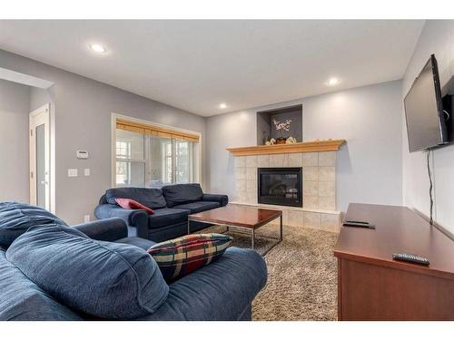 129 Mt Douglas Green Se, Calgary, AB - Indoor Photo Showing Living Room With Fireplace