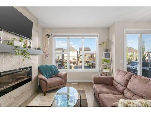 23 Cranbrook Gardens Se, Calgary, AB - Indoor Photo Showing Living Room With Fireplace