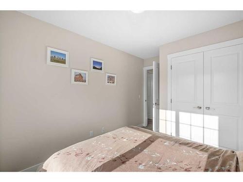 23 Cranbrook Gardens Se, Calgary, AB - Indoor Photo Showing Bedroom