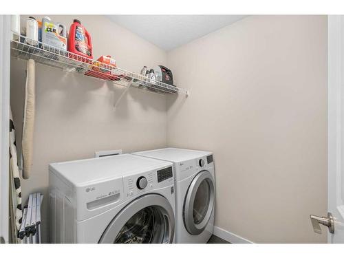 23 Cranbrook Gardens Se, Calgary, AB - Indoor Photo Showing Laundry Room