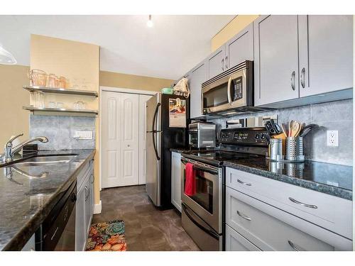 3-203 Village Terrace Sw, Calgary, AB - Indoor Photo Showing Kitchen With Double Sink