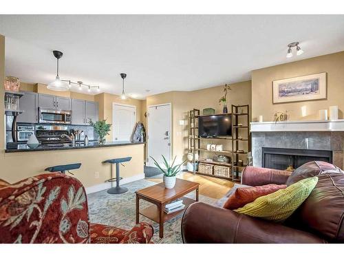 3-203 Village Terrace Sw, Calgary, AB - Indoor Photo Showing Living Room With Fireplace