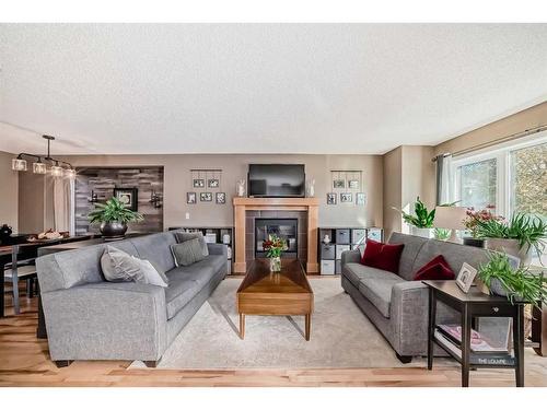 115 Silverado Range Close Sw, Calgary, AB - Indoor Photo Showing Living Room With Fireplace