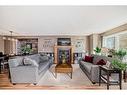 115 Silverado Range Close Sw, Calgary, AB  - Indoor Photo Showing Living Room With Fireplace 