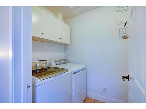 67 Cimarron Drive, Okotoks, AB - Indoor Photo Showing Laundry Room