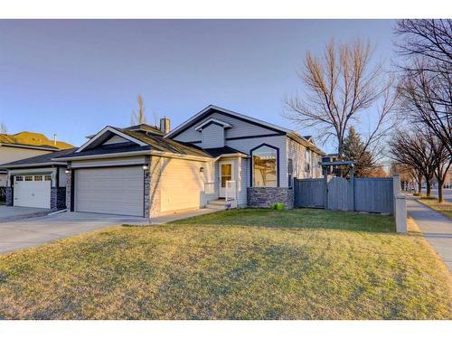 67 Cimarron Drive, Okotoks, AB - Outdoor With Facade