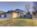 67 Cimarron Drive, Okotoks, AB  - Outdoor With Facade 