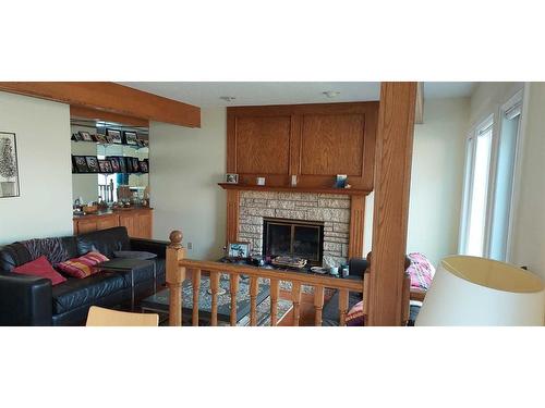 8 Edgeridge Way Nw, Calgary, AB - Indoor Photo Showing Living Room With Fireplace