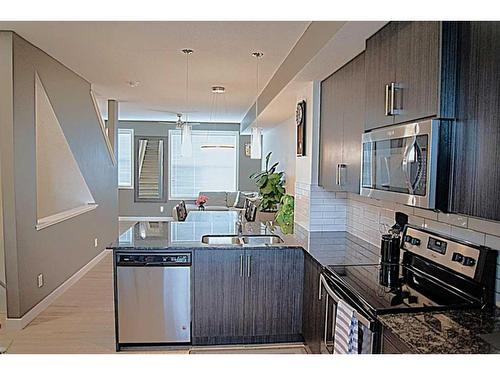 95 Legacy View Se, Calgary, AB - Indoor Photo Showing Kitchen With Stainless Steel Kitchen With Double Sink With Upgraded Kitchen