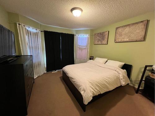 802 Prairie Sound Circle Nw, High River, AB - Indoor Photo Showing Bedroom