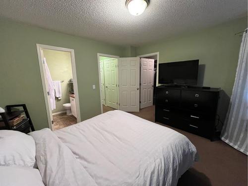 802 Prairie Sound Circle Nw, High River, AB - Indoor Photo Showing Bedroom