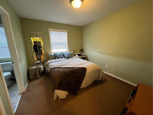 802 Prairie Sound Circle Nw, High River, AB - Indoor Photo Showing Bedroom