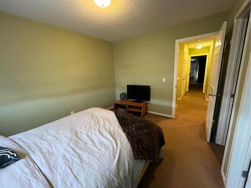 802 Prairie Sound Circle Nw, High River, AB - Indoor Photo Showing Bedroom