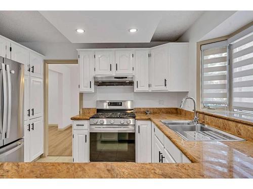 44 Edgepark Court Nw, Calgary, AB - Indoor Photo Showing Kitchen With Double Sink