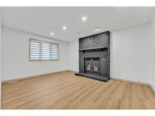 44 Edgepark Court Nw, Calgary, AB - Indoor Photo Showing Living Room With Fireplace