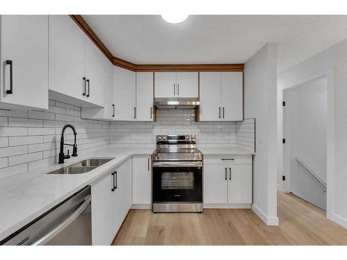 122 Abalone Place Ne, Calgary, AB - Indoor Photo Showing Kitchen With Stainless Steel Kitchen With Double Sink With Upgraded Kitchen