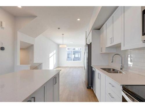 140-8500 19 Avenue Se, Calgary, AB - Indoor Photo Showing Kitchen With Double Sink With Upgraded Kitchen