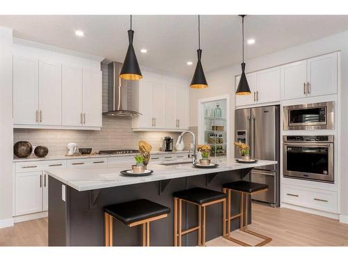 600 Reynolds Crescent Sw, Airdrie, AB - Indoor Photo Showing Kitchen With Upgraded Kitchen