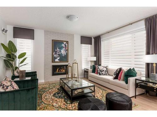 600 Reynolds Crescent Sw, Airdrie, AB - Indoor Photo Showing Living Room With Fireplace