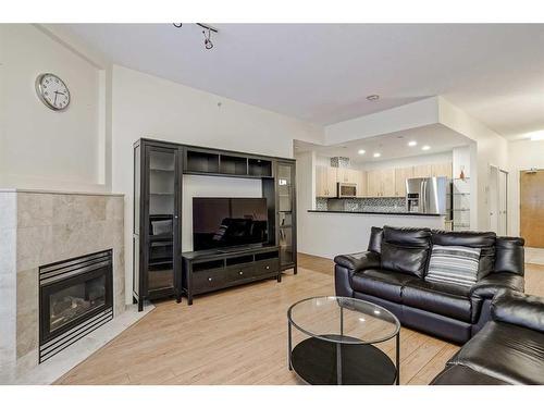 102-1108 6 Avenue Sw, Calgary, AB - Indoor Photo Showing Living Room With Fireplace