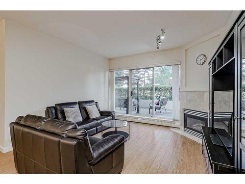 102-1108 6 Avenue Sw, Calgary, AB - Indoor Photo Showing Living Room With Fireplace