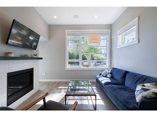 1-138 22 Avenue Ne, Calgary, AB - Indoor Photo Showing Living Room With Fireplace