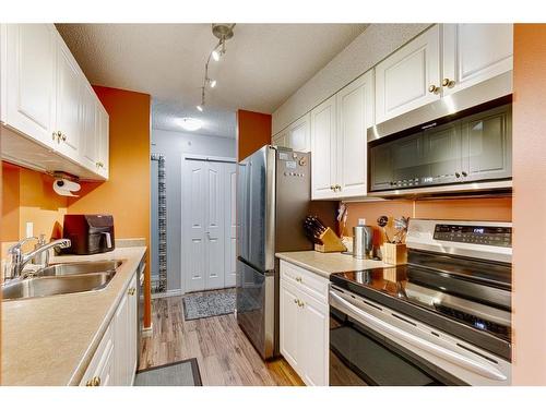 2413-6224 17 Avenue Se, Calgary, AB - Indoor Photo Showing Kitchen With Double Sink