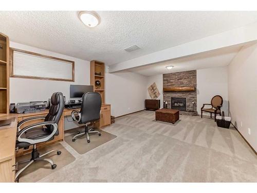 157 Kincora Cove Nw, Calgary, AB - Indoor Photo Showing Office With Fireplace