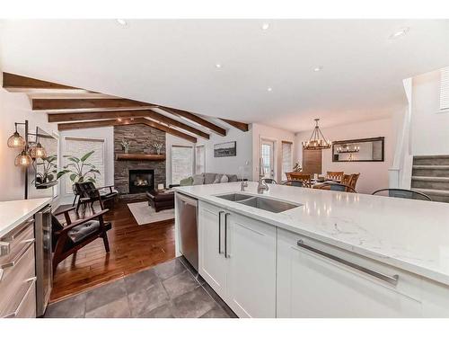 157 Kincora Cove Nw, Calgary, AB - Indoor Photo Showing Kitchen With Fireplace With Double Sink