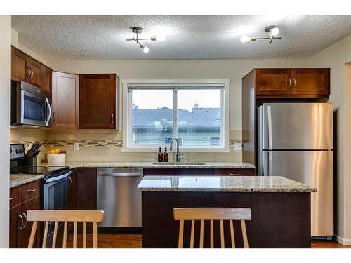 73 Silverado Drive Sw, Calgary, AB - Indoor Photo Showing Kitchen With Stainless Steel Kitchen