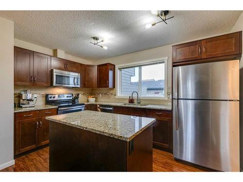 73 Silverado Drive Sw, Calgary, AB - Indoor Photo Showing Kitchen With Stainless Steel Kitchen