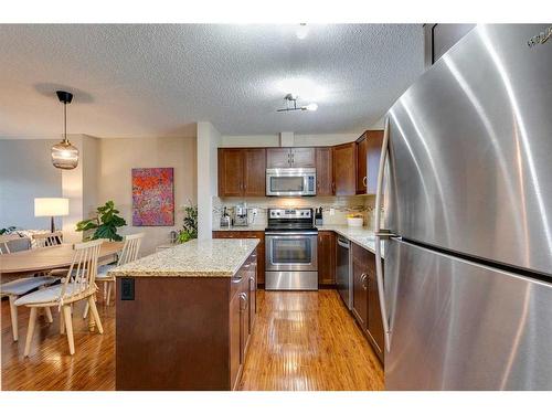 73 Silverado Drive Sw, Calgary, AB - Indoor Photo Showing Kitchen With Stainless Steel Kitchen With Upgraded Kitchen